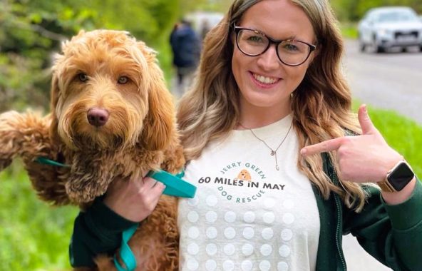 Person holding dog outside