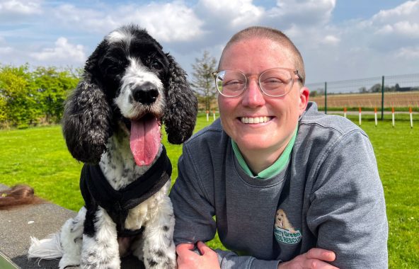 Person sat with dog outside